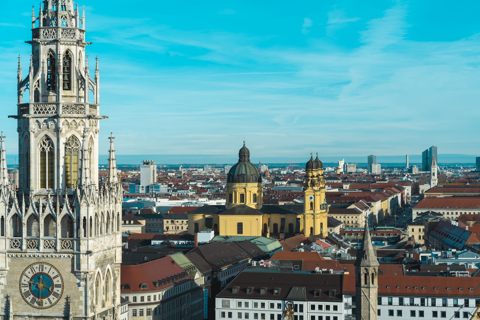 The New Town Hall tower and the Theatine Church over Munich's rooftops